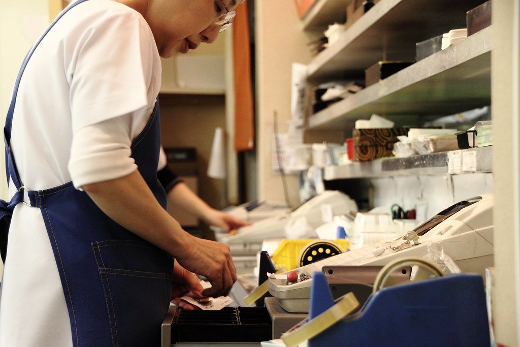 Paying at a cash register