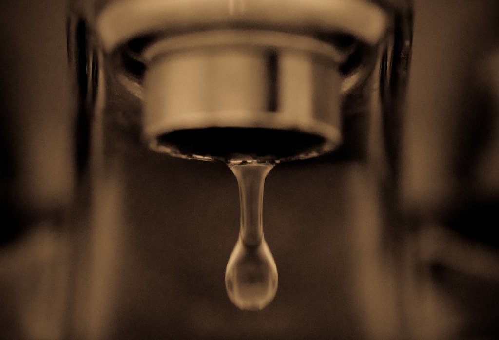 A tap dripping slowly, one drop at a time