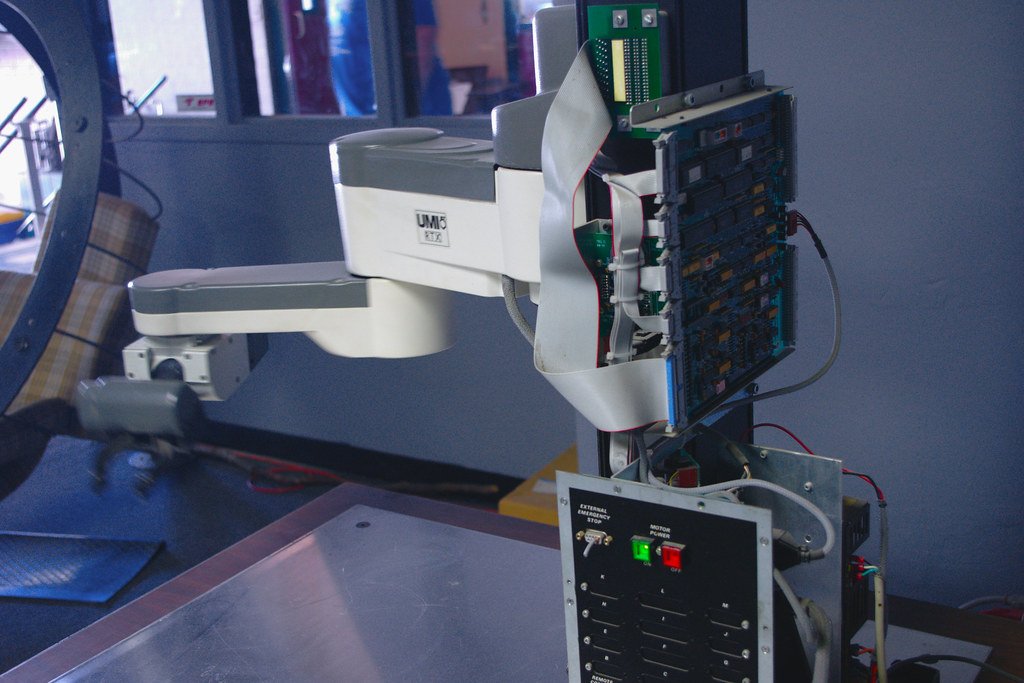 An industrial robotic arm on a workbench