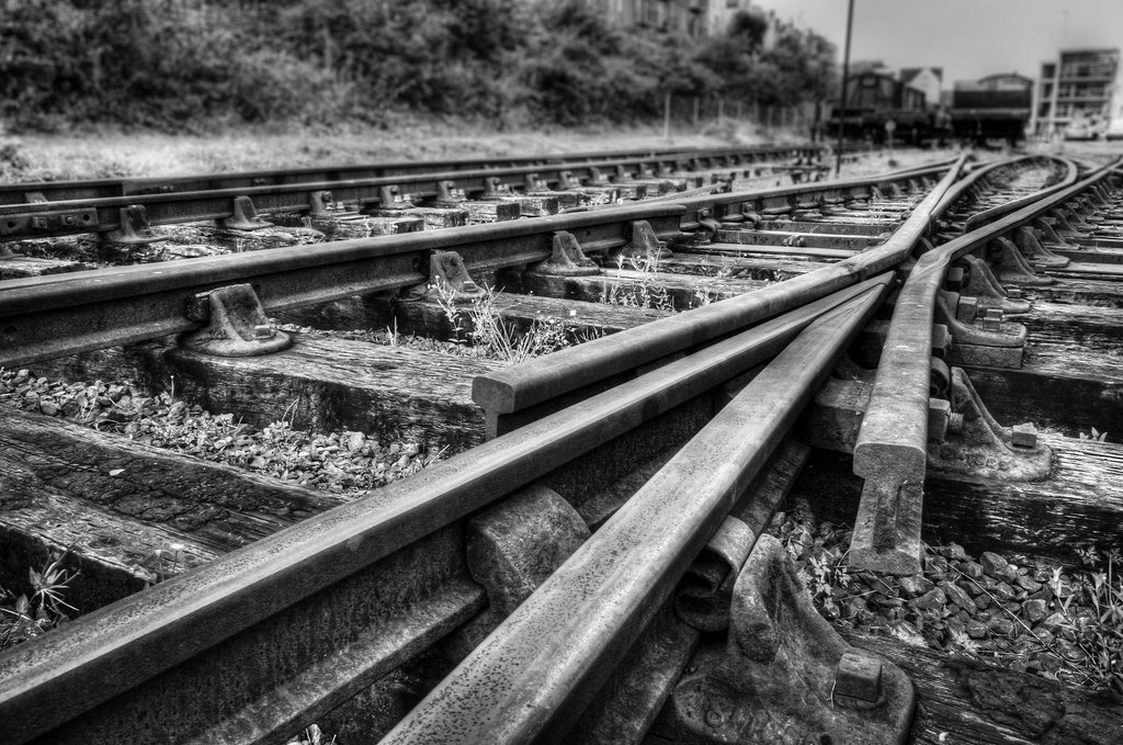 Parallel railway tracks running side by side before diverging