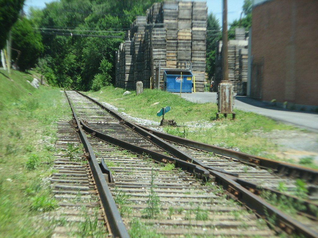 A mechanical railway switch directing a train onto one of two tracks