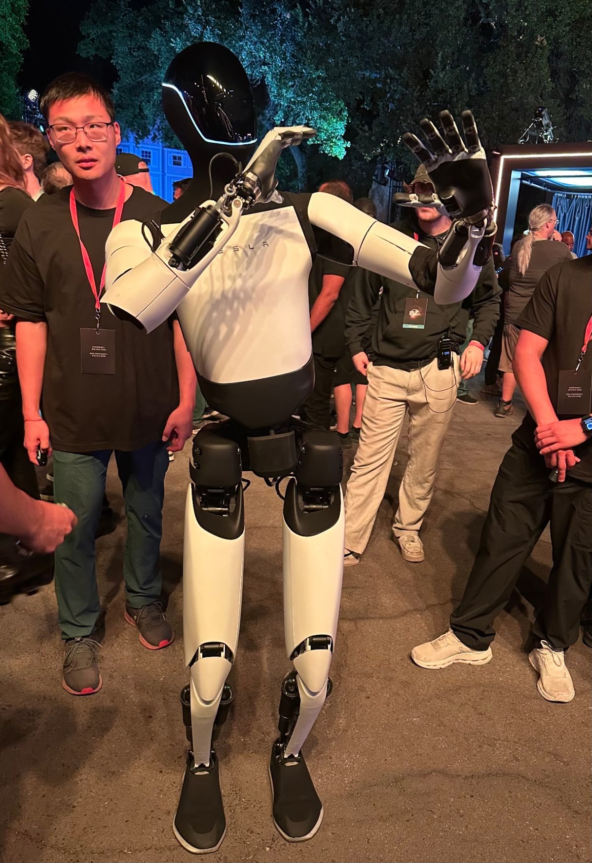 A Tesla Optimus humanoid robot standing upright